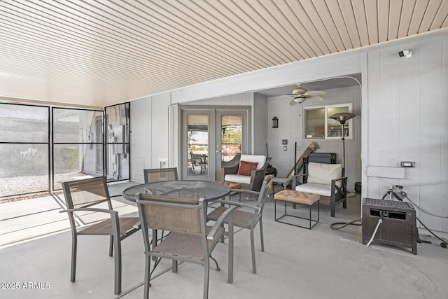 sunroom / solarium featuring ceiling fan