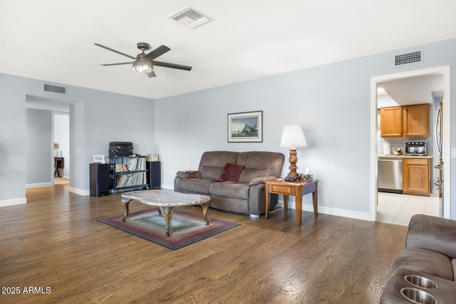 living room featuring light hardwood / wood-style floors and ceiling fan