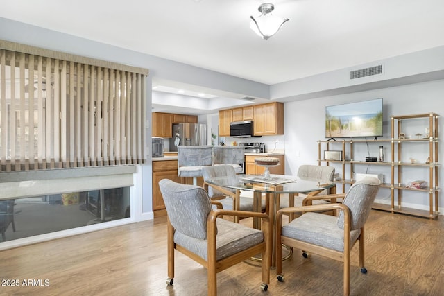 dining room featuring light wood-type flooring