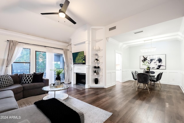 living room with vaulted ceiling, ceiling fan, dark hardwood / wood-style floors, and ornamental molding