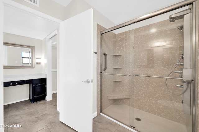 bathroom featuring an enclosed shower and vanity