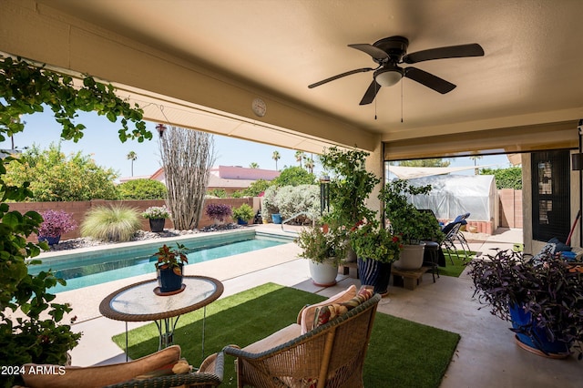 view of pool featuring ceiling fan and a patio