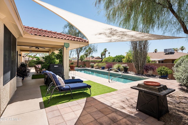 view of pool featuring ceiling fan, a patio, and central air condition unit