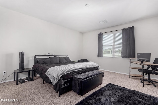 bedroom with carpet floors, visible vents, and baseboards