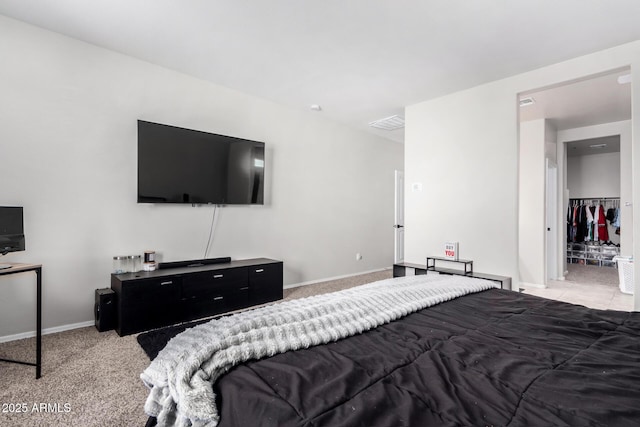 carpeted bedroom with visible vents and baseboards