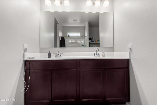 bathroom featuring double vanity and a sink