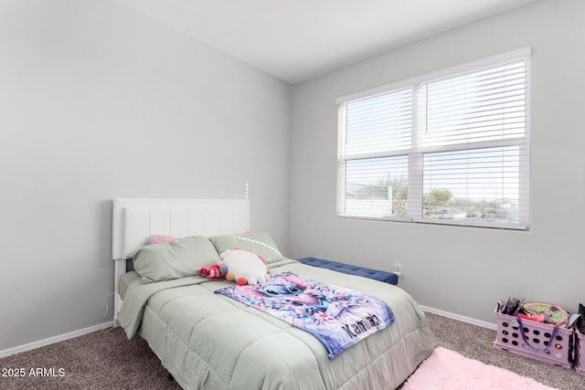 bedroom with carpet flooring and baseboards