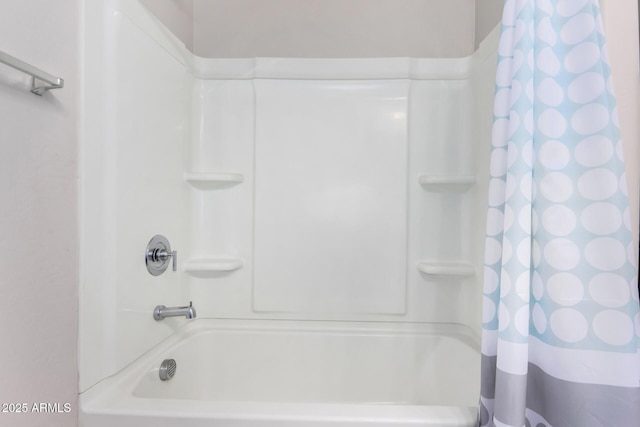 bathroom featuring shower / tub combo with curtain