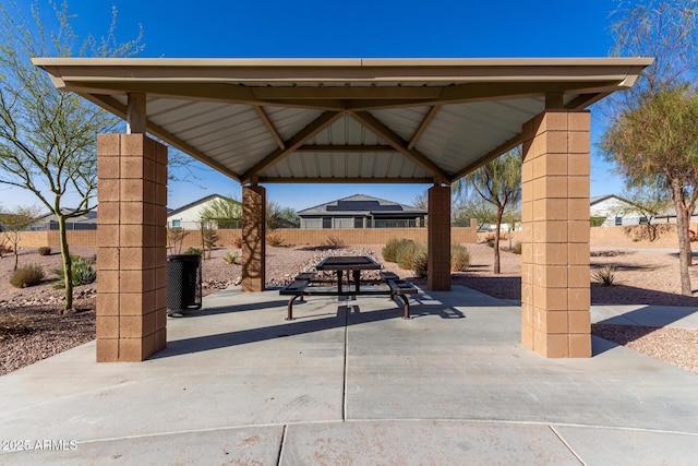 view of home's community with a fenced backyard, a patio, and a gazebo