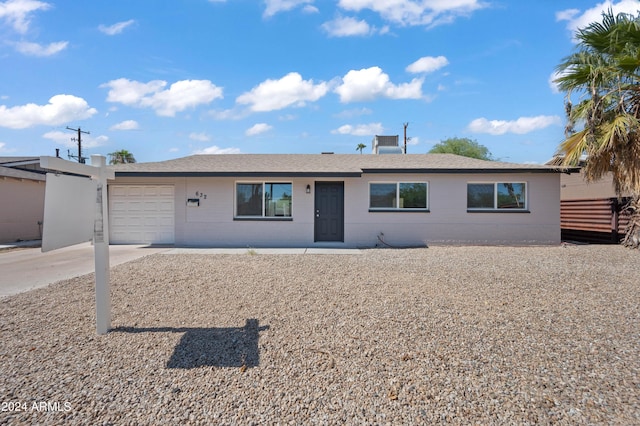 ranch-style house featuring a garage