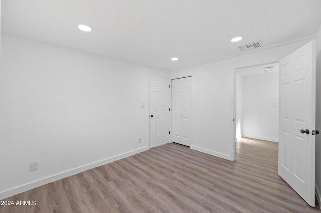 empty room featuring hardwood / wood-style flooring