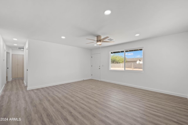 unfurnished room with ceiling fan and light hardwood / wood-style floors