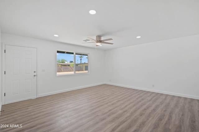 unfurnished room with ceiling fan and light hardwood / wood-style floors