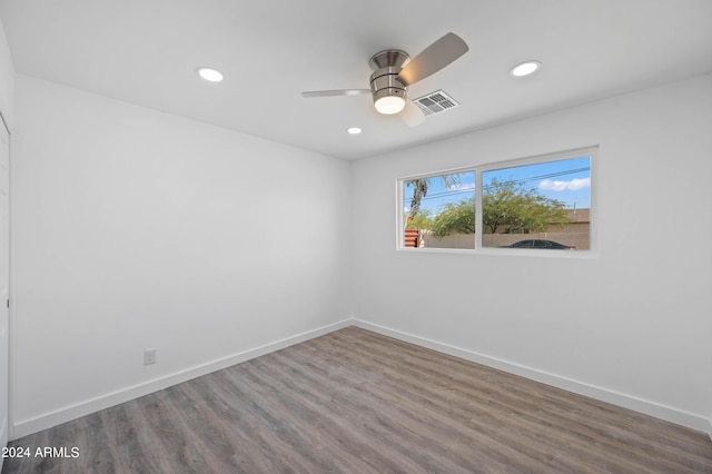 unfurnished room featuring ceiling fan and wood-type flooring