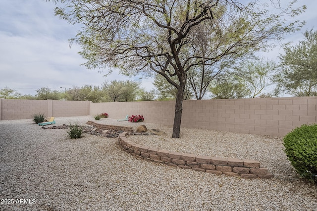 view of yard featuring a fenced backyard