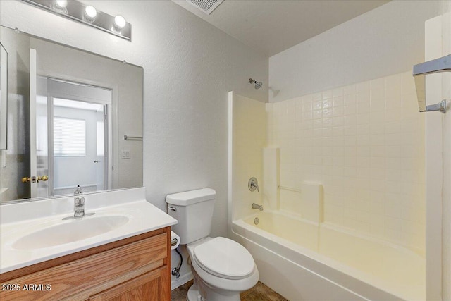 full bathroom with shower / bath combination, visible vents, vanity, toilet, and a textured wall
