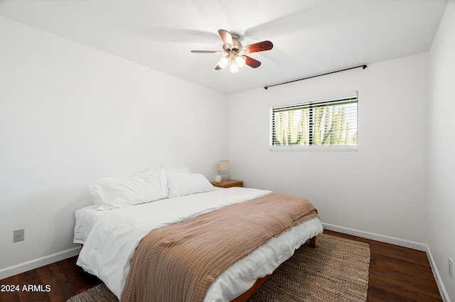 bedroom featuring ceiling fan and dark hardwood / wood-style flooring