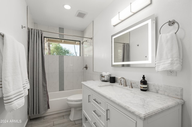 full bathroom featuring vanity, toilet, shower / tub combo with curtain, and hardwood / wood-style floors