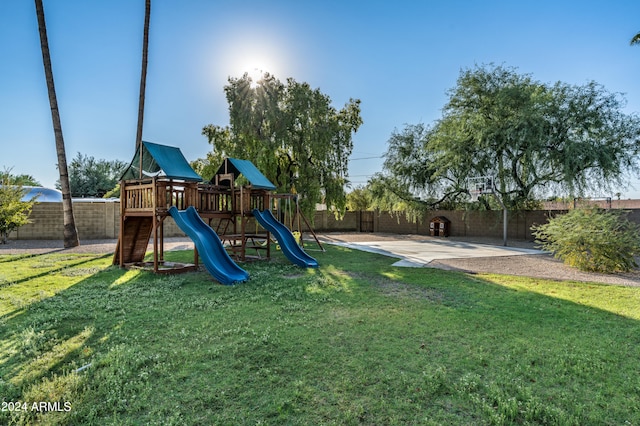 view of jungle gym with a lawn