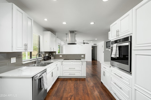 kitchen with stainless steel appliances, white cabinetry, sink, dark wood-type flooring, and ceiling fan