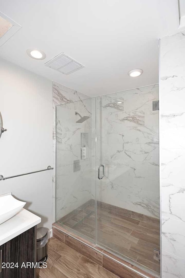 bathroom with vanity and an enclosed shower