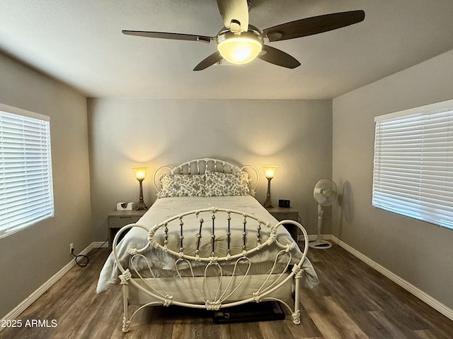 bedroom featuring ceiling fan, baseboards, and wood finished floors