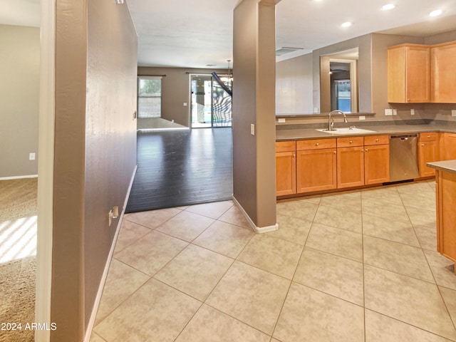 kitchen with dishwasher, light hardwood / wood-style floors, and sink