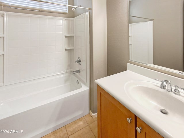 bathroom with washtub / shower combination, vanity, and tile patterned floors