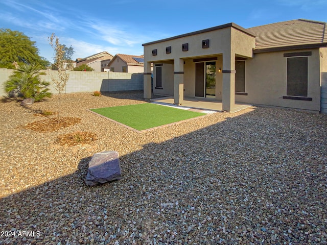 rear view of house featuring a patio area