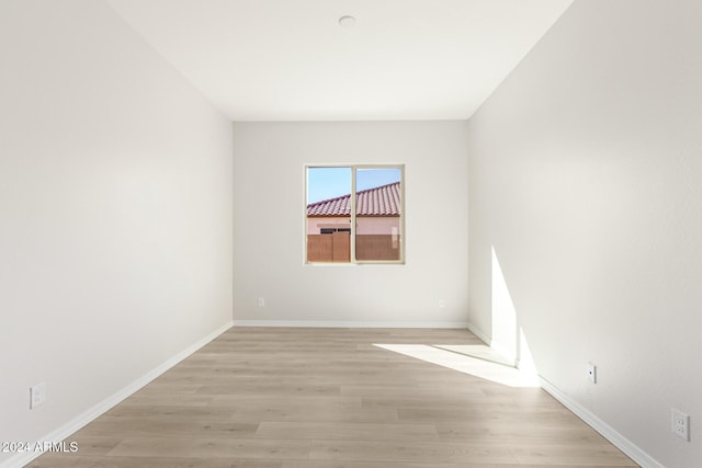 empty room with light wood-type flooring