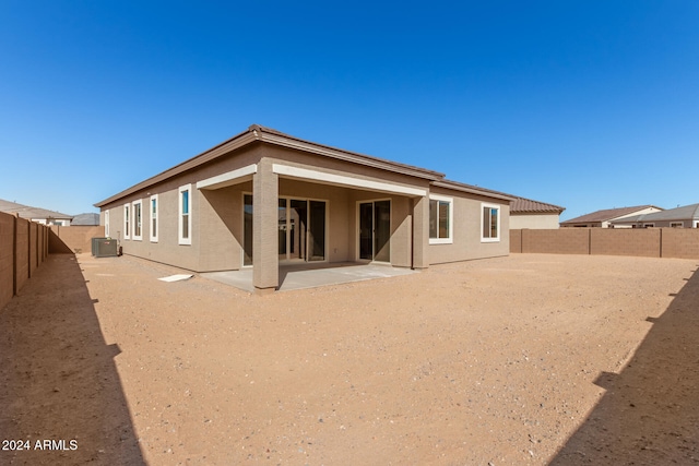 back of house featuring central AC unit and a patio