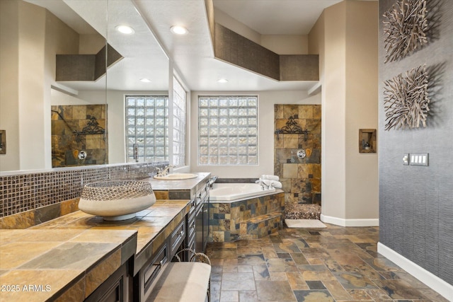 34096 N 87th Way, Scottsdale, AZ 85266 - full bath with stone tile floors, baseboards, walk in shower, recessed lighting, and a bath