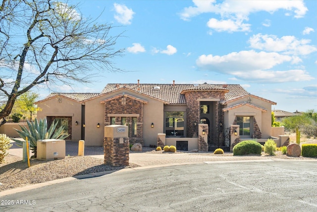 34096 N 87th Way, Scottsdale, AZ 85266 - view of front facade with stucco siding, a tiled roof, and stone siding