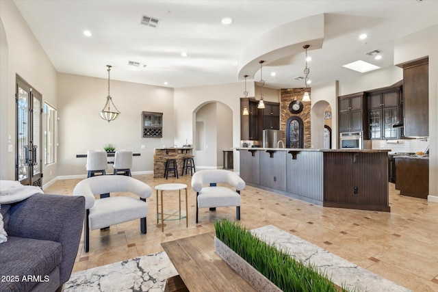 34096 N 87th Way, Scottsdale, AZ 85266 - living area featuring visible vents, french doors, recessed lighting, and arched walkways