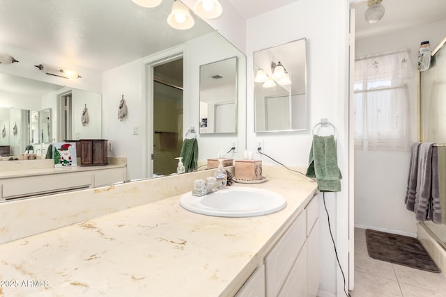 full bath with vanity, tile patterned floors, and visible vents