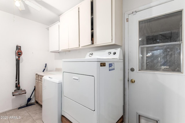 washroom with light tile patterned floors, cabinet space, separate washer and dryer, and a ceiling fan