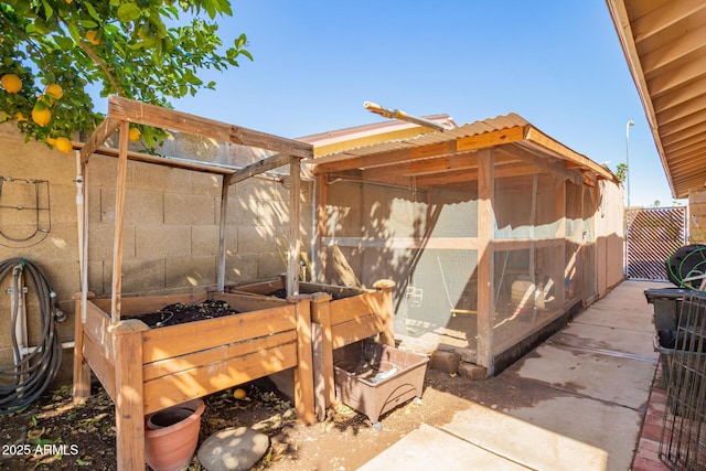 view of patio / terrace featuring an outbuilding