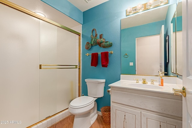 24801 N Vado Ct, Rio Verde, AZ 85263 - full bath with toilet, a shower stall, vanity, wood finished floors, and baseboards