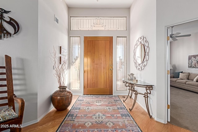 24801 N Vado Ct, Rio Verde, AZ 85263 - foyer with baseboards, a high ceiling, light wood finished floors, and a ceiling fan