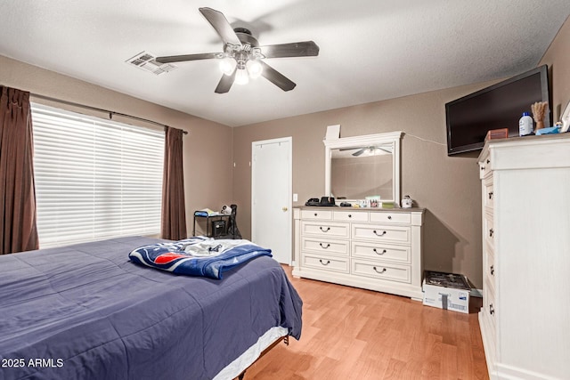2202 S Lawther Dr, Apache Junction, AZ 85120 - bedroom featuring light wood-type flooring and a ceiling fan