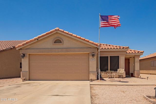 2202 S Lawther Dr, Apache Junction, AZ 85120 - view of front of property with driveway, a tile roof, an attached garage, and stucco siding