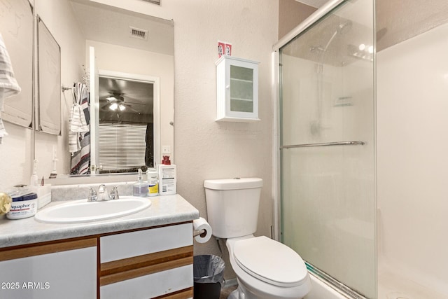 2202 S Lawther Dr, Apache Junction, AZ 85120 - bathroom with a stall shower, vanity, and ceiling fan