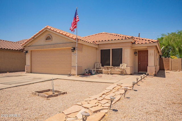 2202 S Lawther Dr, Apache Junction, AZ 85120 - mediterranean / spanish home with stucco siding, a garage, concrete driveway, and a tile roof