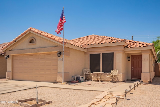 2202 S Lawther Dr, Apache Junction, AZ 85120 - view of front of property featuring a garage, driveway, a tiled roof, and stucco siding