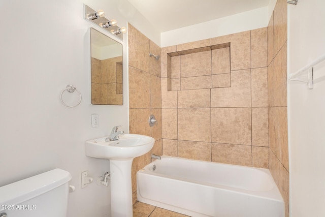 full bathroom featuring toilet, bathtub / shower combination, and tile patterned flooring