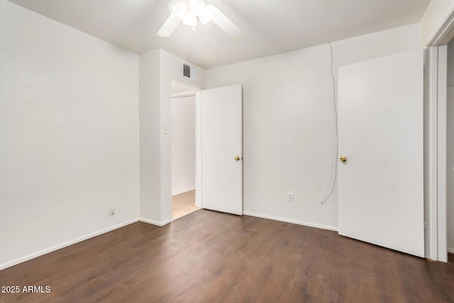 unfurnished bedroom featuring visible vents, baseboards, wood finished floors, and a ceiling fan