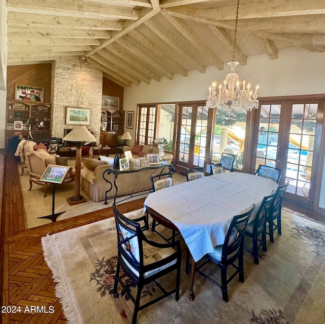 dining area featuring beamed ceiling, french doors, parquet floors, a chandelier, and high vaulted ceiling