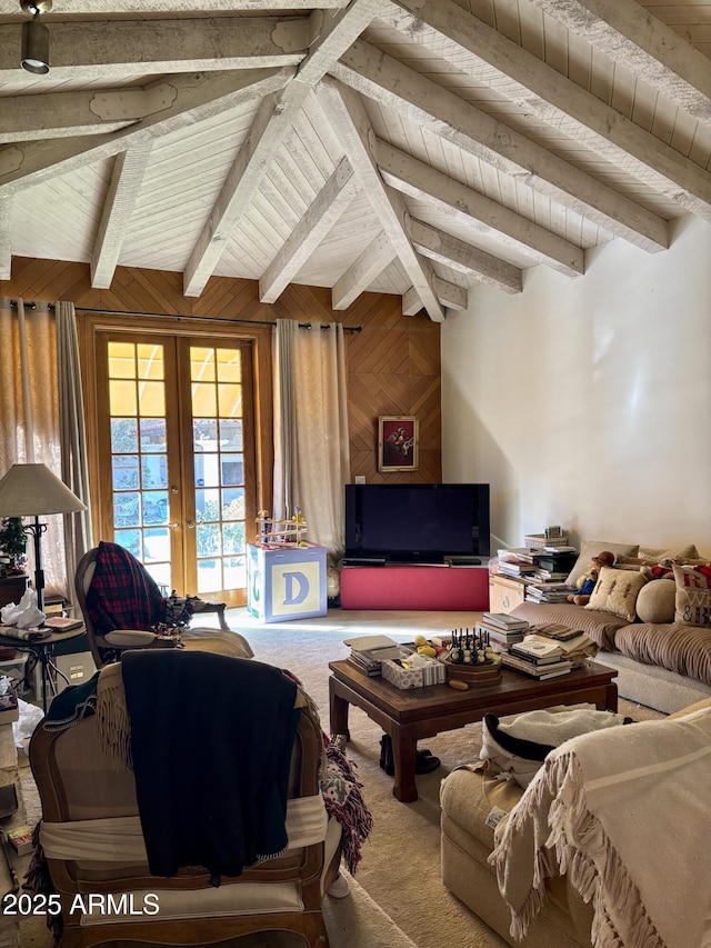 living room featuring carpet, wood walls, beamed ceiling, french doors, and wooden ceiling