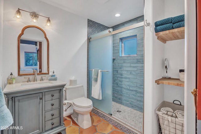 full bathroom with a stall shower, toilet, recessed lighting, vanity, and tile patterned flooring