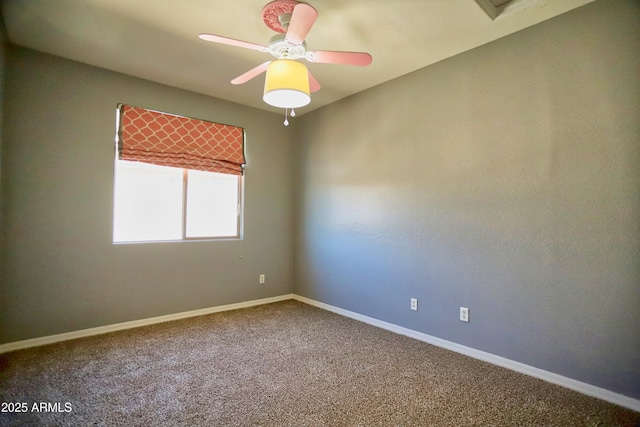 empty room with carpet floors, baseboards, and a ceiling fan